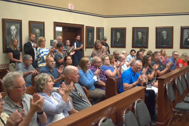 Attendees at Tuesday's Gage County Planning and Zoning Commission meeting cheer following the board's unanimous vote to advance an 18-month moratorium on data centers. | June 16, 2026 | Photo: Chase Porter/Courier Nebraska
