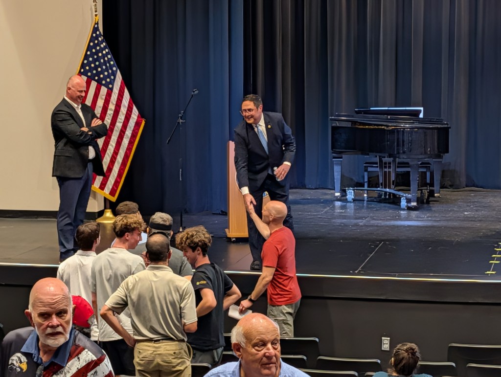 Nebraska 1st District Rep. Mike Flood greets constituents following a public town hall event hosted in Bellevue, Nebraska, on Tuesday, June 7, 2026. | Photo: Chase Porter/Courier Nebraska