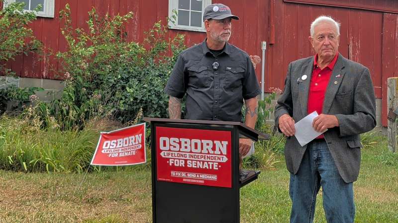 Dan Osborn, Independent candidate for US Senate in Nebraska, stands with John Hansen, President of the Nebraska Farmers Union, on Thursday, July 23, 2026, in Syracuse, Nebraska for an announcement. | Photo: Chase Porter/Courier Nebraska