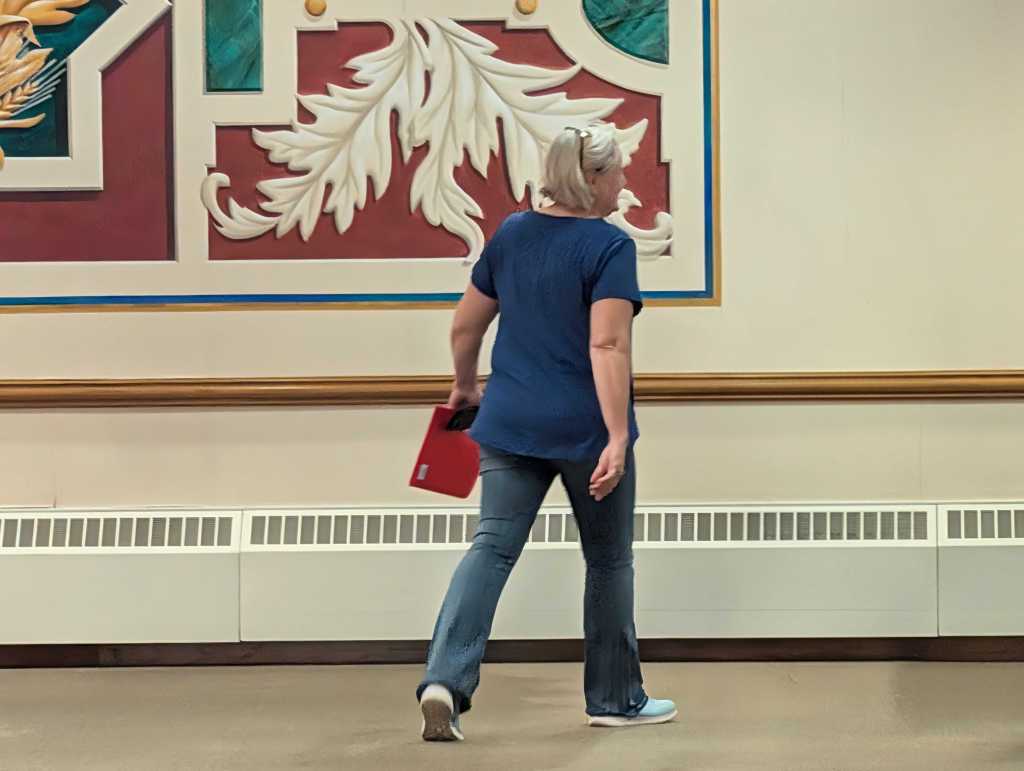 Cindy Burbank, former Democratic nominee for US Senate in Nebraska, walks off, returning to civilian life after withdrawing from the race on Friday, July 17, 2026. | Photo: Chase Porter/Courier Nebraska