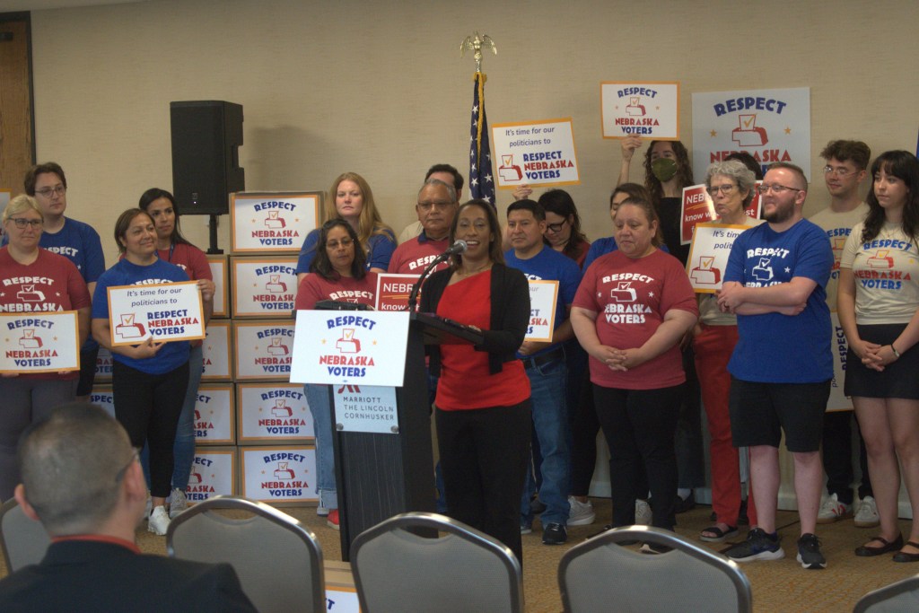 Jo Giles, executive director of the Women's Fund of Omaha and campaign sponsors for Respect Nebraska Voters, speaks during a press conference on July 2, 2026. | Photo: Chase Porter/Courier Nebraska