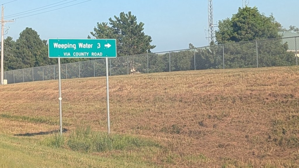 Mileage sign for Weeping Water, Nebraska | Phot: Chase Porter/Courier Nebraska