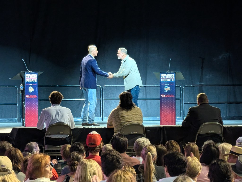 Republican US Sen. Pete Ricketts (left) and Independent candidate Dan Osborn (right) shake hands following the Nebraska US Senate debate on Tuesday, Sept. 1, 2026. | Photo: Chase Porter/ Courier Nebraska