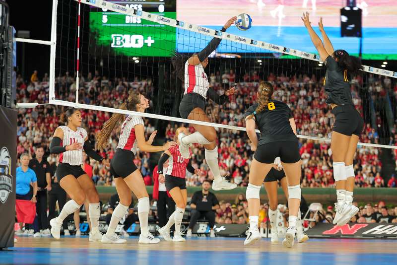 Manaia Ogbechie celebrates on the court during a Nebraska volleyball match