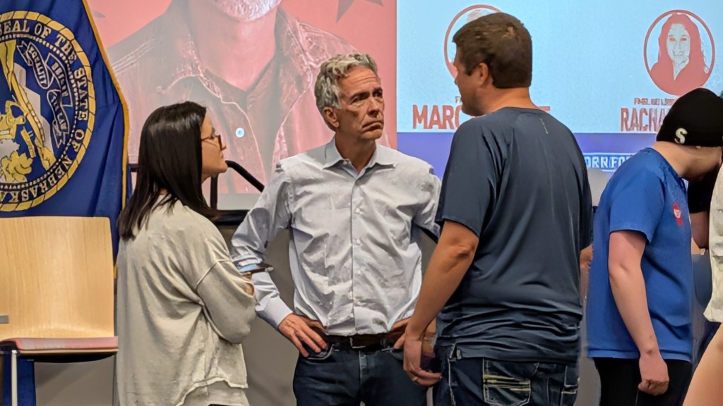 Former US Rep. Joe Walsh (R-Ill.) talks with attendees after a “cross-party” town hall for Dan Osborn’s U.S. Senate campaign in Omaha, Neb., on Saturday, Oct. 24. Photo: Chase Porter/Courier Nebraska.