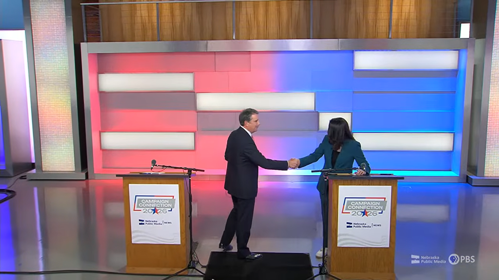 Republican Brinker Harding (left) shakes hands with Democrat Denise Powell (right) after the Nebraska 2nd Congressional District debate hosted by Nebraska Public Media on Wendesday, Oct. 14, 2026. | Photo taken from Nebraska Public Media live broadcast