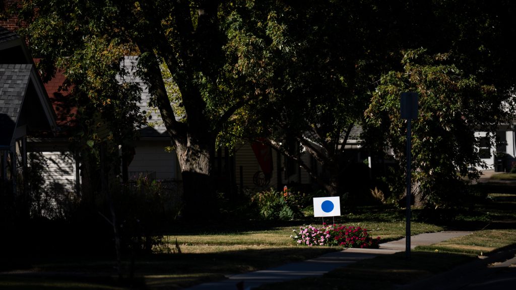 Blue dot campaign signs are planted in front of houses in Omaha, Neb., on Tuesday, October 15, 2024. (Bill Clark/CQ-Roll Call, Inc via Getty Images)